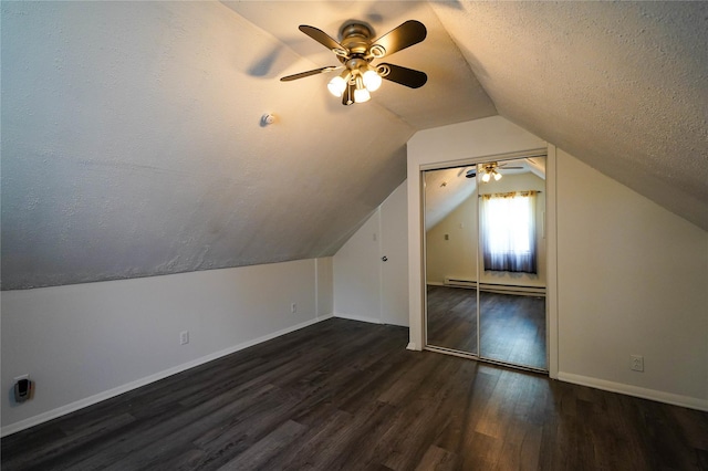 342 Mildred St, Oceanside, NY 11572 - additional living space featuring a baseboard radiator, wood finished floors, ceiling fan, lofted ceiling, and a textured ceiling