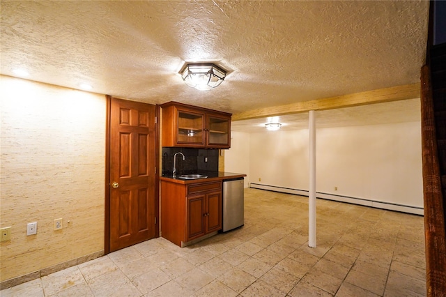342 Mildred St, Oceanside, NY 11572 - kitchen with baseboard heating, dark countertops, dishwasher, brown cabinets, and a textured ceiling