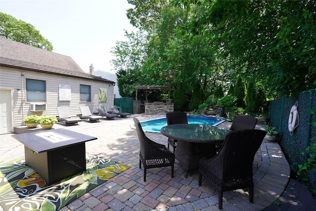 342 Mildred St, Oceanside, NY 11572 - view of patio with outdoor dining space, a pergola, an outdoor pool, and cooling unit