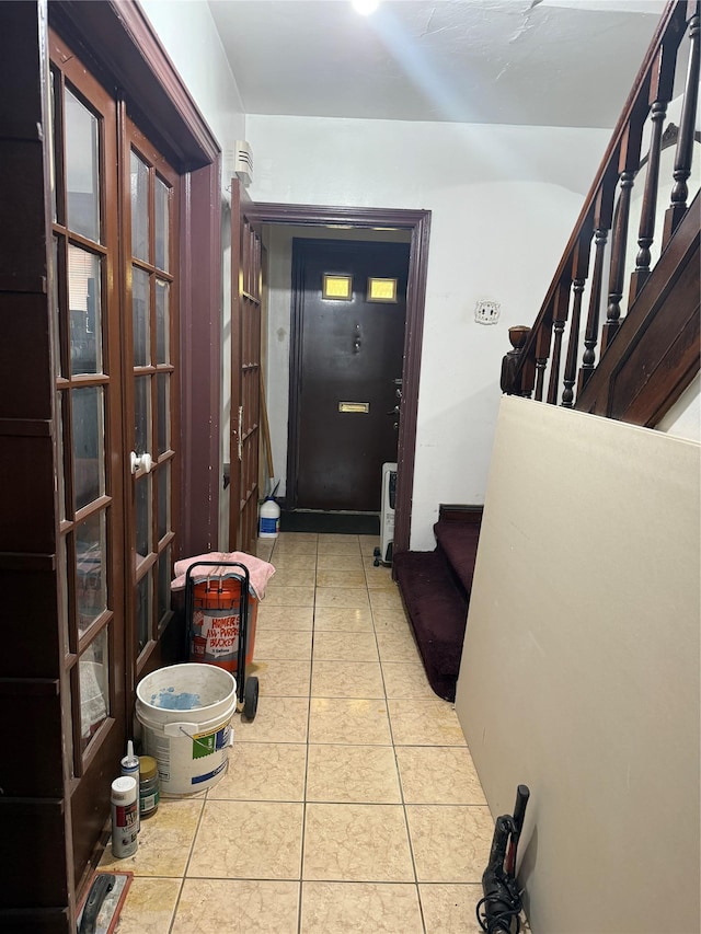 2449 92nd St, East Elmhurst, NY 11369 - entrance foyer featuring light tile patterned flooring, stairway, and french doors