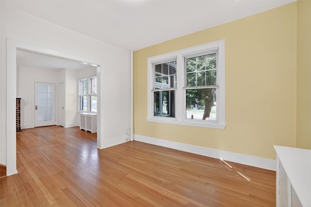 175 N Regent St, Port Chester, NY 10573 - spare room featuring light wood-style flooring and radiator heating unit