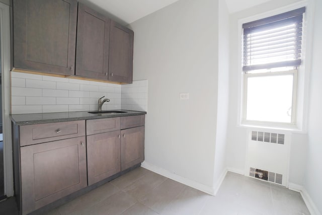 5621 Netherland Ave Unit 5C, Bronx, NY 10471 - washroom featuring radiator heating unit and light tile patterned flooring