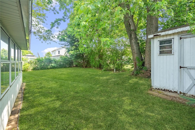 337 Atlantic Ave, Massapequa Park, NY 11762 - fenced backyard featuring a storage unit