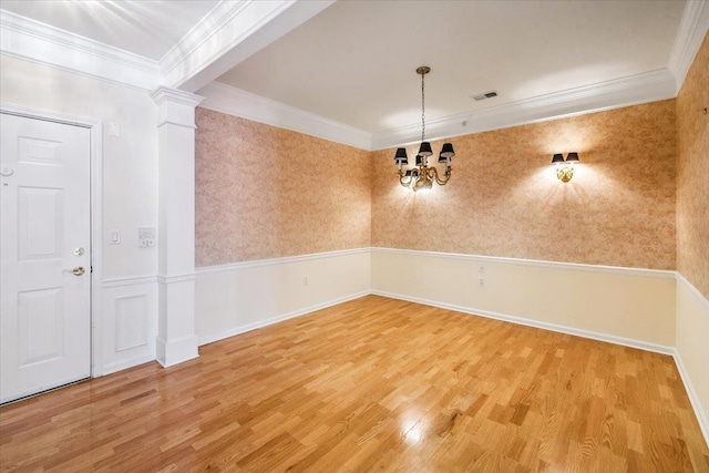26 N De Baun Ave Unit 303, Suffern, NY 10901 - spare room with wood finished floors, a chandelier, decorative columns, and ornamental molding