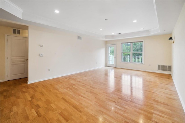 26 N De Baun Ave Unit 303, Suffern, NY 10901 - unfurnished room with a raised ceiling, light wood-type flooring, ornamental molding, and recessed lighting