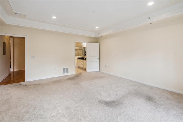 26 N De Baun Ave Unit 303, Suffern, NY 10901 - spare room featuring light carpet, a raised ceiling, recessed lighting, and a smoke detector