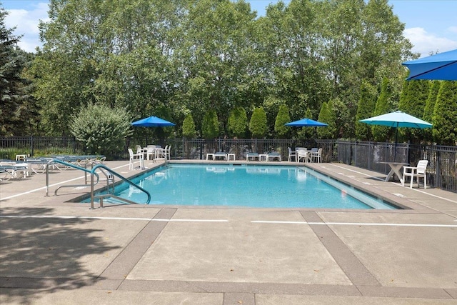 26 N De Baun Ave Unit 303, Suffern, NY 10901 - community pool with a patio and view of wooded area