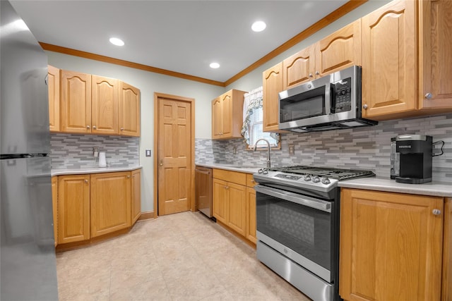 231 Wilson St, West Hempstead, NY 11552 - kitchen with appliances with stainless steel finishes, ornamental molding, light countertops, backsplash, and recessed lighting