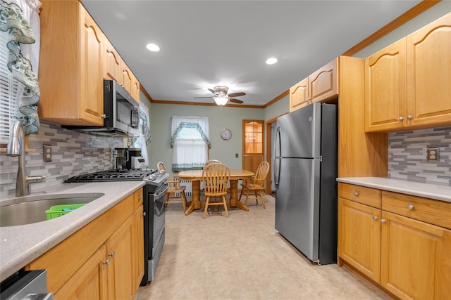 231 Wilson St, West Hempstead, NY 11552 - kitchen with appliances with stainless steel finishes, a ceiling fan, ornamental molding, light countertops, and backsplash