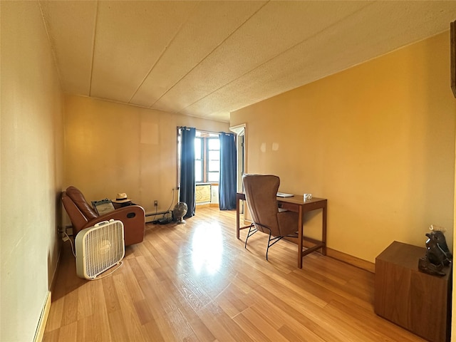 130-14 60th Ave Unit 2E, Flushing, NY 11355 - sitting room featuring light wood-type flooring and a baseboard radiator