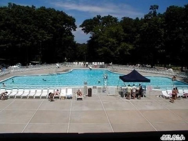 23 Birchwood Rd Unit 23, Coram, NY 11727 - community pool featuring a patio area