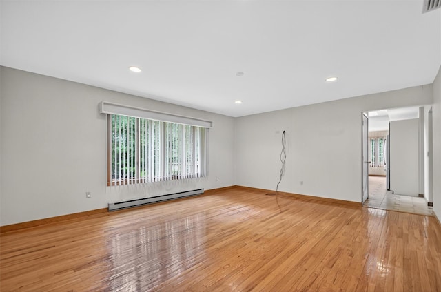 35 Greenlawn Rd, Amawalk, NY 10501 - empty room featuring a baseboard radiator, light wood-type flooring, and recessed lighting
