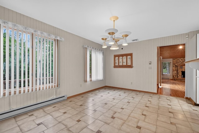35 Greenlawn Rd, Amawalk, NY 10501 - unfurnished room featuring a baseboard heating unit, healthy amount of natural light, and a chandelier