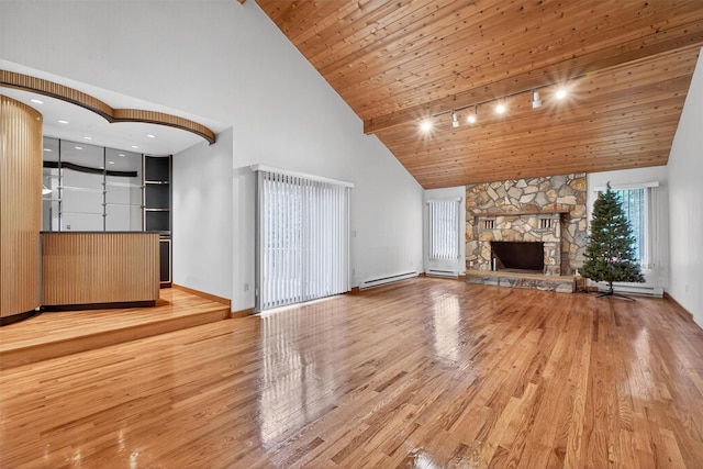 35 Greenlawn Rd, Amawalk, NY 10501 - unfurnished living room featuring high vaulted ceiling, light wood-type flooring, track lighting, wood ceiling, and a baseboard radiator
