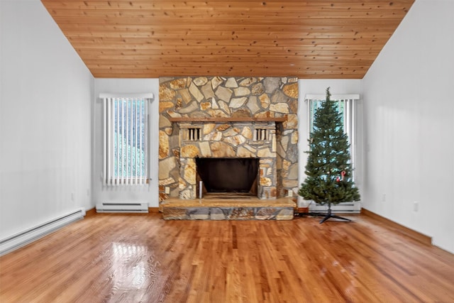 35 Greenlawn Rd, Amawalk, NY 10501 - unfurnished living room with a baseboard radiator, wood ceiling, a fireplace, wood finished floors, and vaulted ceiling