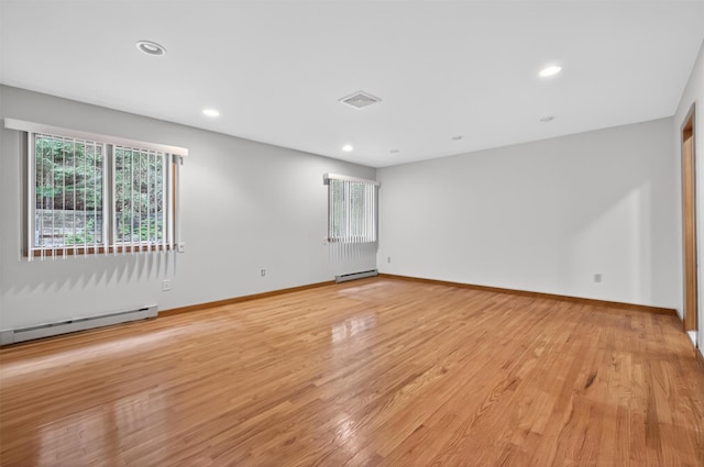 35 Greenlawn Rd, Amawalk, NY 10501 - unfurnished room featuring a baseboard radiator, light wood-style floors, and recessed lighting