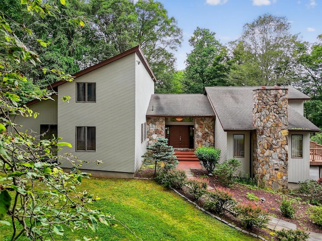 35 Greenlawn Rd, Amawalk, NY 10501 - mid-century modern home featuring stone siding, a shingled roof, a front yard, and a chimney