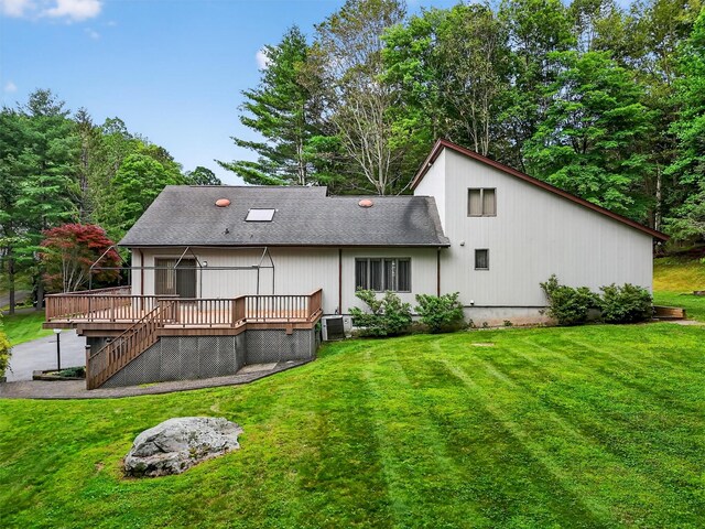 35 Greenlawn Rd, Amawalk, NY 10501 - rear view of house with a wooden deck, a yard, and roof with shingles