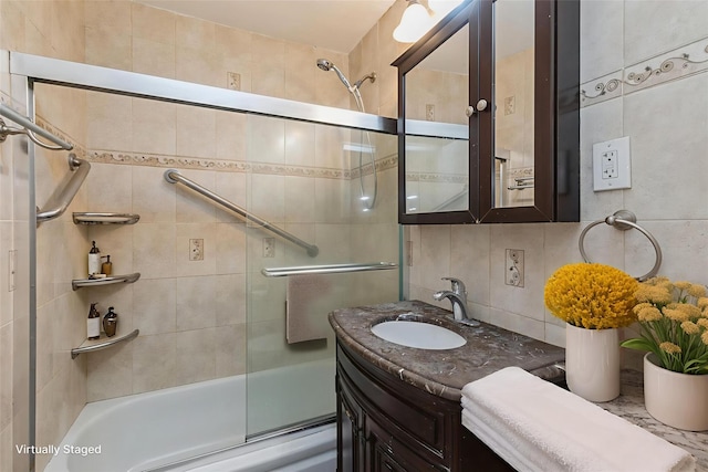 99-10 60th Ave Unit C1C, Corona, NY 11368 - full bathroom featuring enclosed tub / shower combo, backsplash, vanity, and tile walls