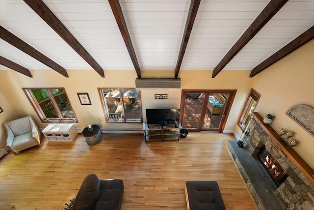 474 Swanson Dr, Thornwood, NY 10594 - living area featuring a lit fireplace and light wood-style flooring