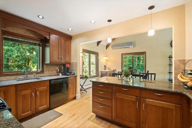 474 Swanson Dr, Thornwood, NY 10594 - kitchen with black dishwasher, a wall unit AC, brown cabinets, and recessed lighting