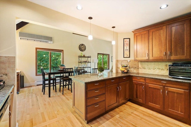 474 Swanson Dr, Thornwood, NY 10594 - kitchen with an AC wall unit, light wood-style floors, healthy amount of natural light, backsplash, and recessed lighting