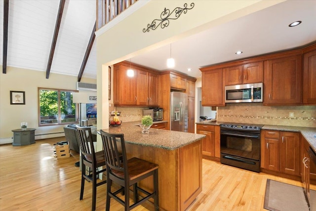 474 Swanson Dr, Thornwood, NY 10594 - kitchen featuring stainless steel appliances, light wood-style floors, dark stone countertops, brown cabinets, and beam ceiling