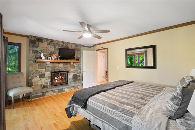 474 Swanson Dr, Thornwood, NY 10594 - bedroom featuring wood finished floors, a fireplace, ornamental molding, and ceiling fan