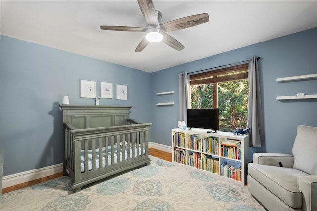 474 Swanson Dr, Thornwood, NY 10594 - bedroom with wood finished floors, a crib, and ceiling fan