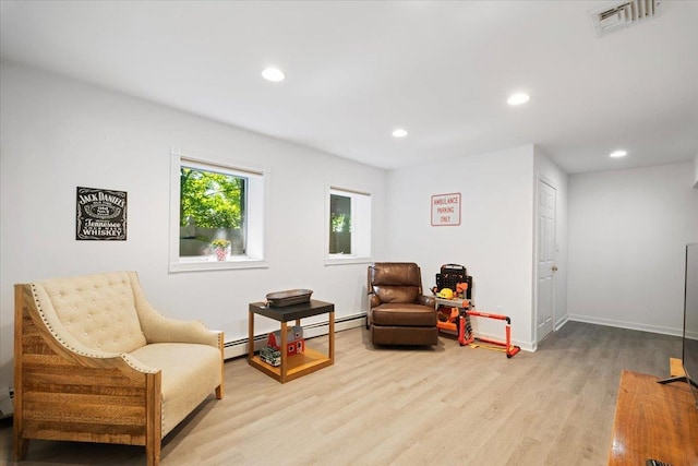 474 Swanson Dr, Thornwood, NY 10594 - living area with wood finished floors, recessed lighting, and baseboard heating