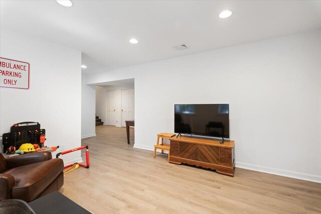 474 Swanson Dr, Thornwood, NY 10594 - living room with light wood-style floors, recessed lighting, and stairway