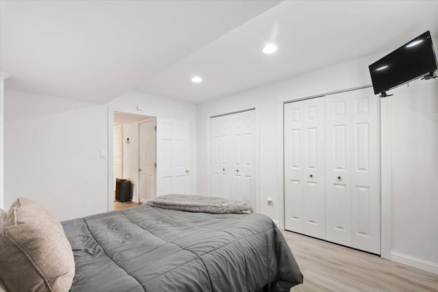 474 Swanson Dr, Thornwood, NY 10594 - bedroom featuring two closets, light wood finished floors, and recessed lighting