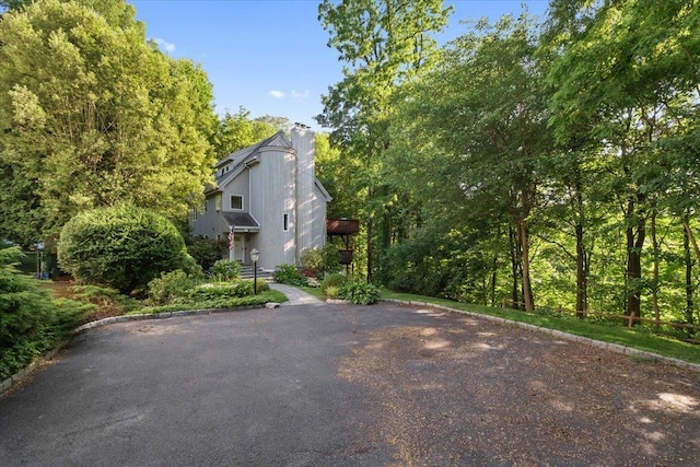474 Swanson Dr, Thornwood, NY 10594 - view of side of property with a chimney