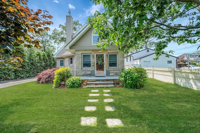 246 Cadman Ave, Babylon, NY 11702 - view of front of property with stone siding and a chimney