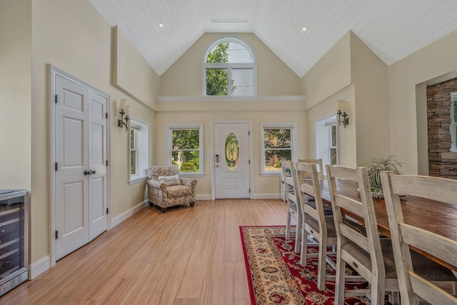 246 Cadman Ave, Babylon, NY 11702 - foyer with wine cooler, light wood finished floors, and high vaulted ceiling