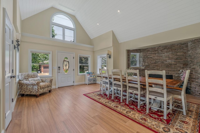 246 Cadman Ave, Babylon, NY 11702 - dining area featuring high vaulted ceiling and wood finished floors