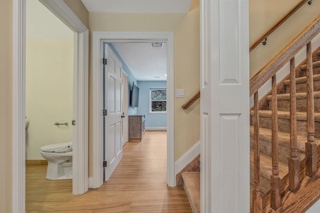 246 Cadman Ave, Babylon, NY 11702 - hall featuring light wood finished floors and stairs