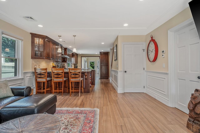 246 Cadman Ave, Babylon, NY 11702 - living room with light wood-type flooring, a wainscoted wall, a decorative wall, and recessed lighting