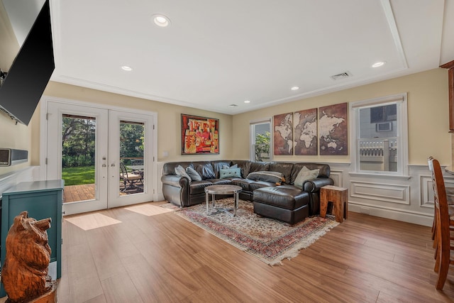 246 Cadman Ave, Babylon, NY 11702 - living room featuring french doors, wainscoting, wood finished floors, and recessed lighting