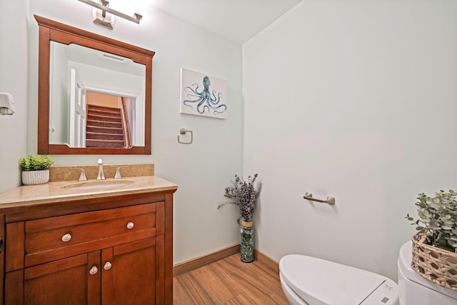 246 Cadman Ave, Babylon, NY 11702 - bathroom featuring vanity and wood finished floors