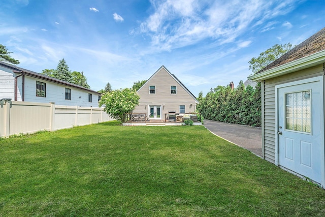 246 Cadman Ave, Babylon, NY 11702 - back of house with french doors and a patio area
