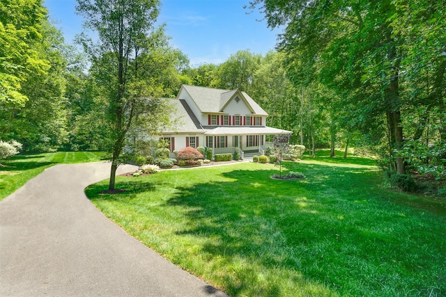 76 Warren St, Somers, NY 10589 - view of front facade with covered porch, a front yard, and driveway