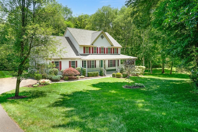 76 Warren St, Somers, NY 10589 - view of front facade featuring covered porch, a front lawn, and roof with shingles