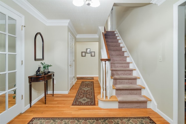 76 Warren St, Somers, NY 10589 - foyer entrance with wood finished floors, stairs, and crown molding
