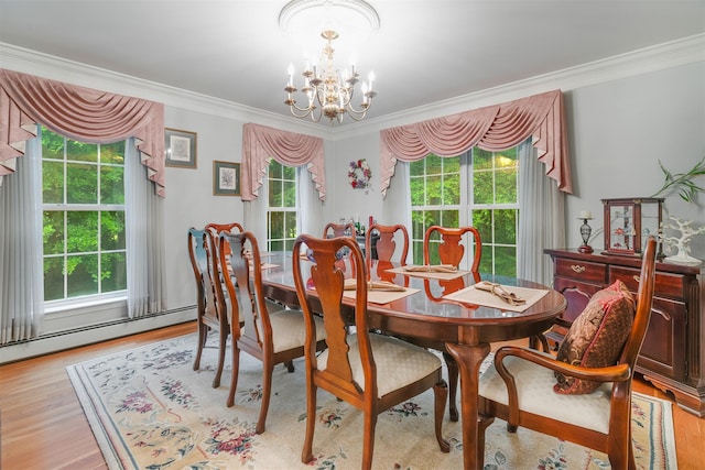 76 Warren St, Somers, NY 10589 - dining space featuring a chandelier, crown molding, wood finished floors, and baseboard heating
