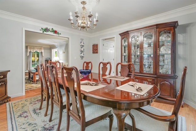 76 Warren St, Somers, NY 10589 - dining space with a chandelier, light wood finished floors, and crown molding