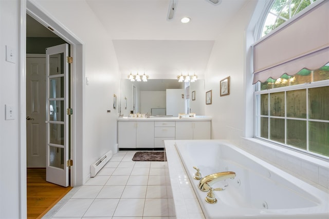 76 Warren St, Somers, NY 10589 - full bathroom with a baseboard heating unit, vanity, healthy amount of natural light, and a jetted tub