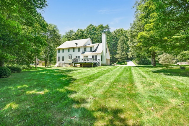 76 Warren St, Somers, NY 10589 - back of house with a deck, a chimney, and a yard