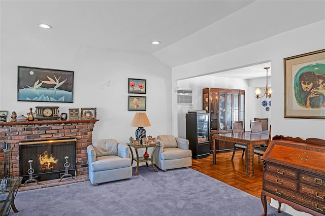 11 Rupert Pl, Melville, NY 11747 - living area with lofted ceiling, a brick fireplace, a chandelier, recessed lighting, and an AC wall unit