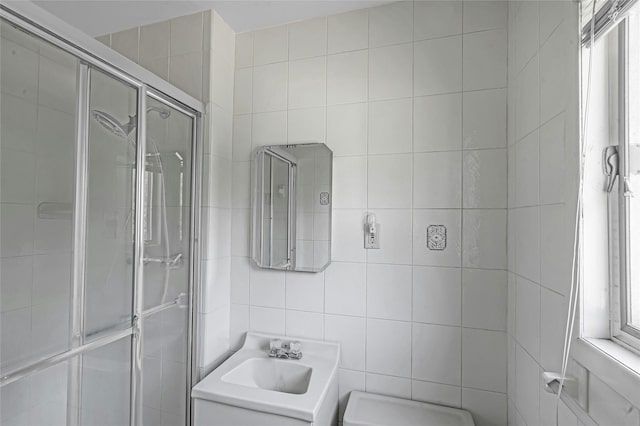 11 Rupert Pl, Melville, NY 11747 - bathroom featuring tile walls, a shower stall, and vanity